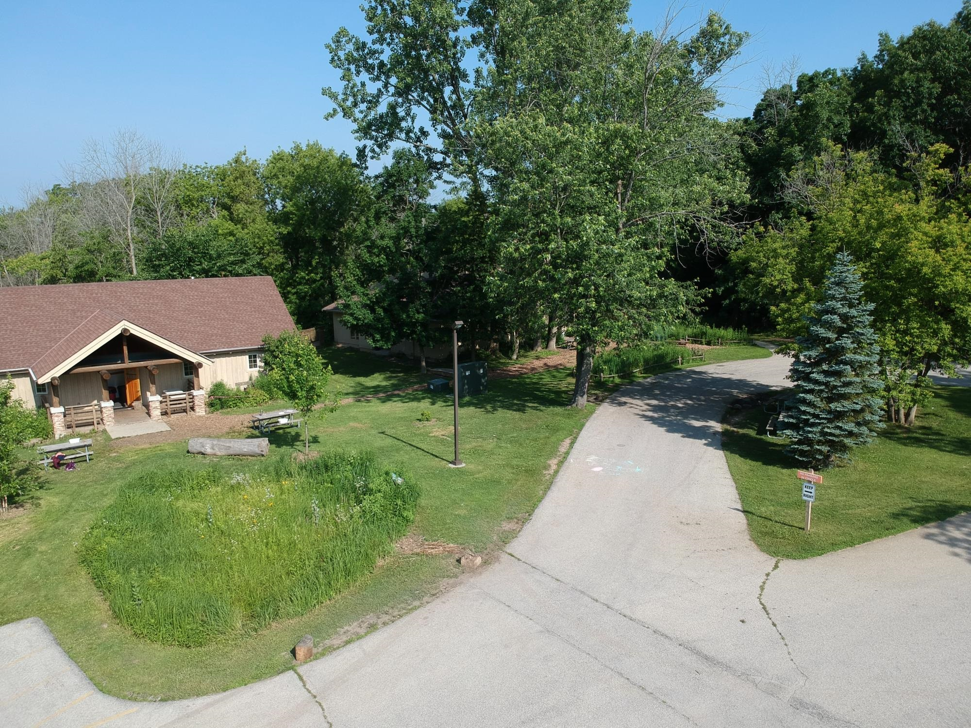 Birdwatching at River Bend Nature Center in Racine, Wisconsin, featuring native Wisconsin bird species in forest and wetland habitat.